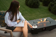Mesa de Fuego de Gas para Jardín Planika Rio: Elegancia para tu Espacio Exterior — en patio, por la mañana, con llama encendida